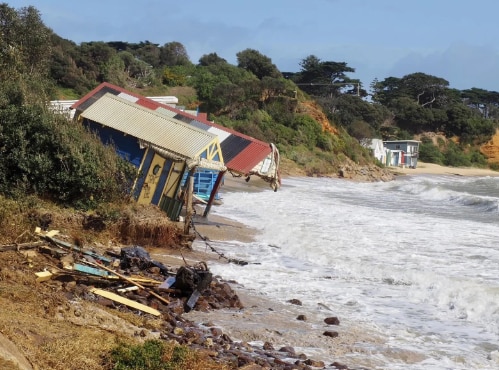 Strong winds buckled beach boxes in Mornington on Monday.