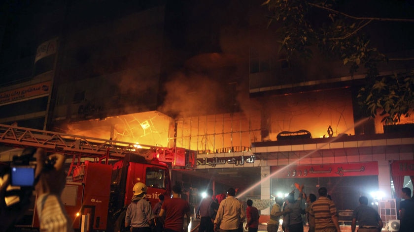 Firemen battle a blaze at Soma Hotel in the northern Iraqi city of Sulaimaniya