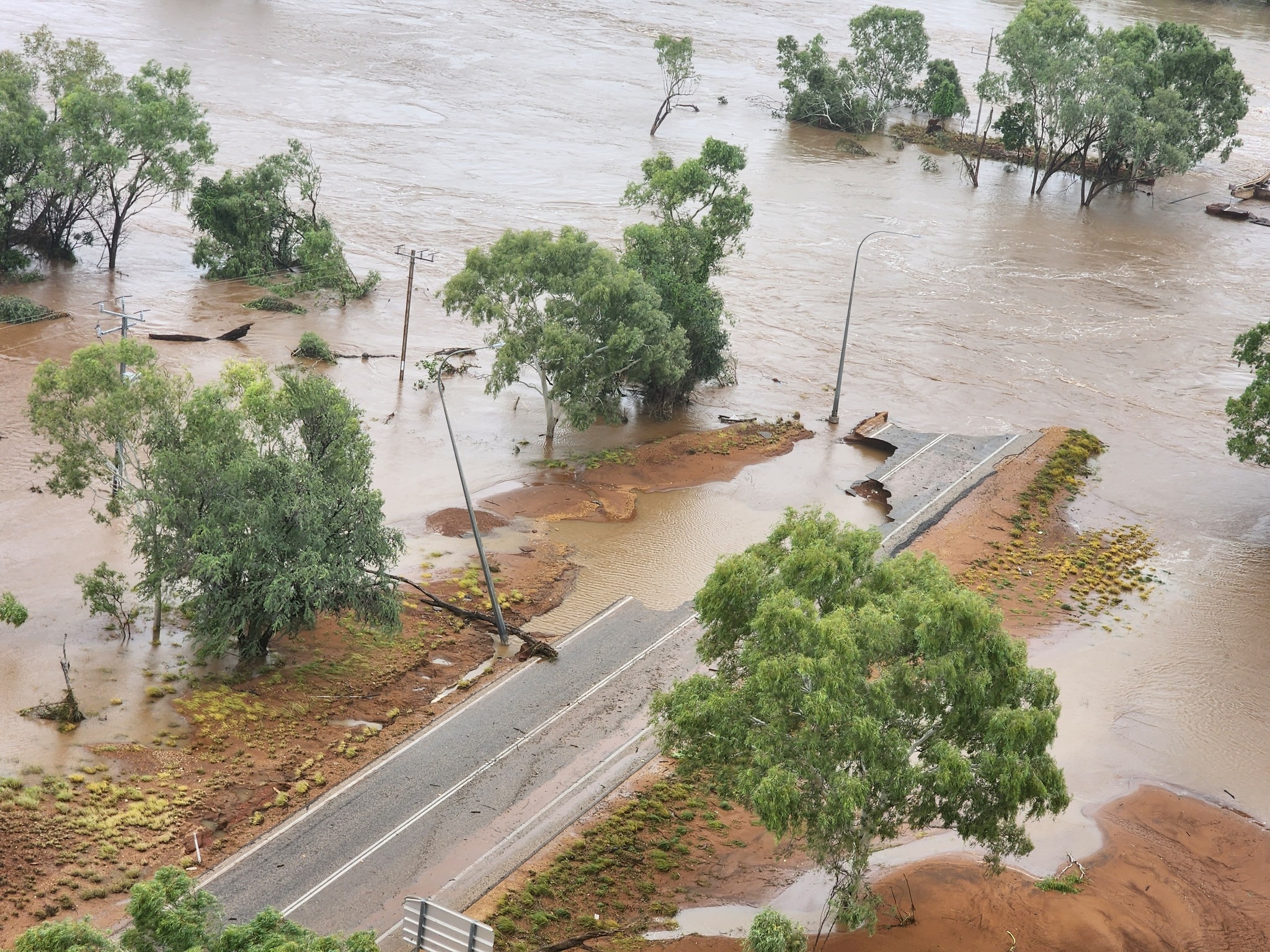  A bridge and parts of highway submerged in floodwaters 
