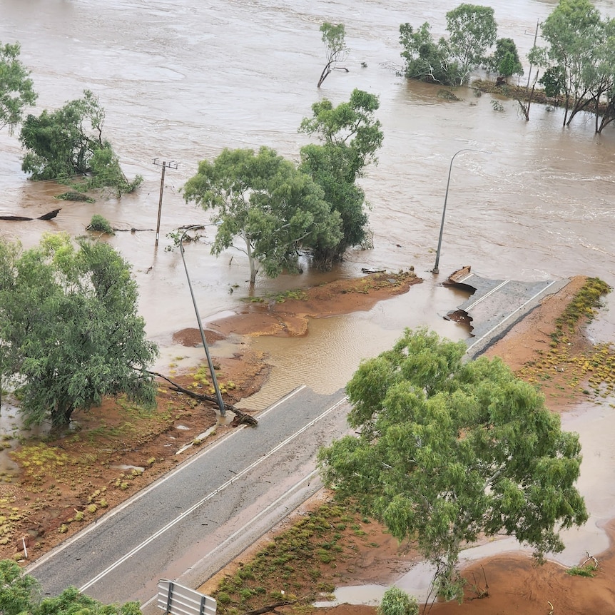  A bridge and parts of highway submerged in floodwaters 