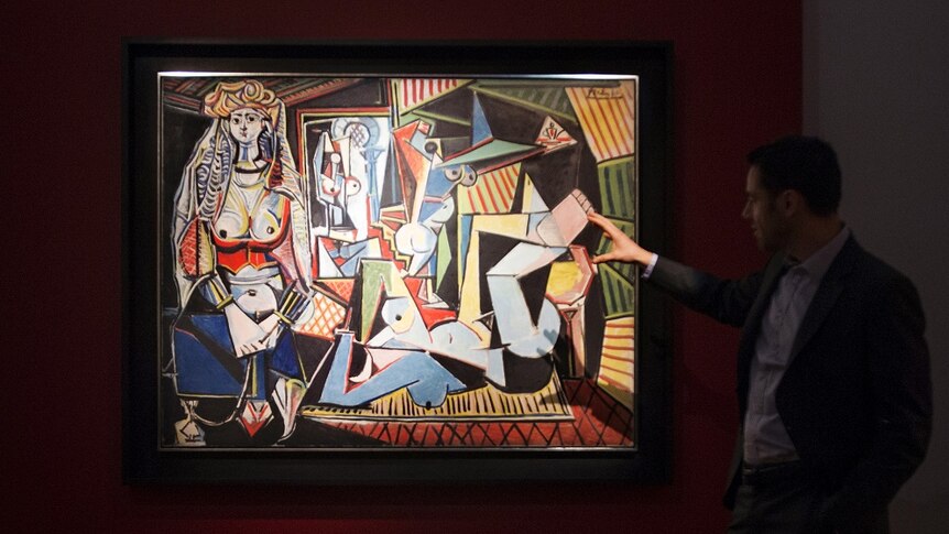 A man views Picasso's painting Les femmes d'Alger (Version 'O')