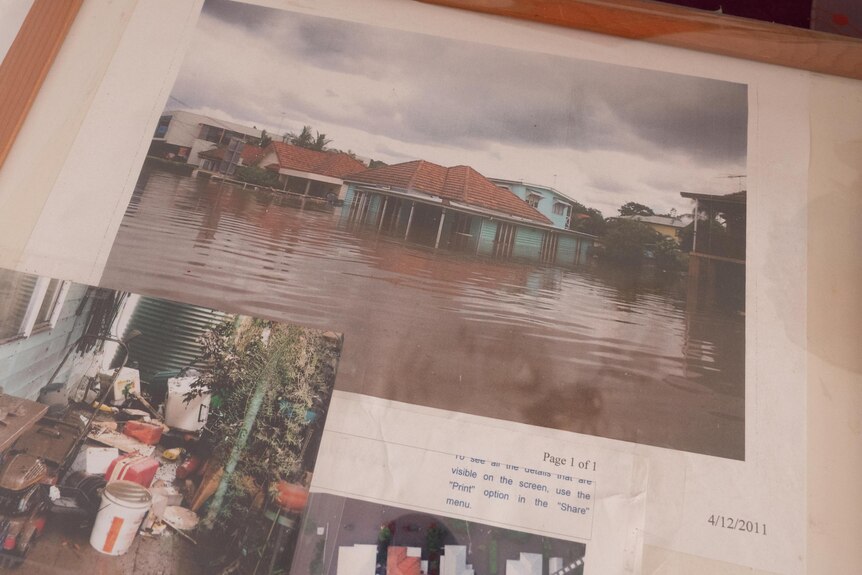 A framed photo of a flooded Margherita Gellel inundated with water during the 2011 floods in Brisbane.