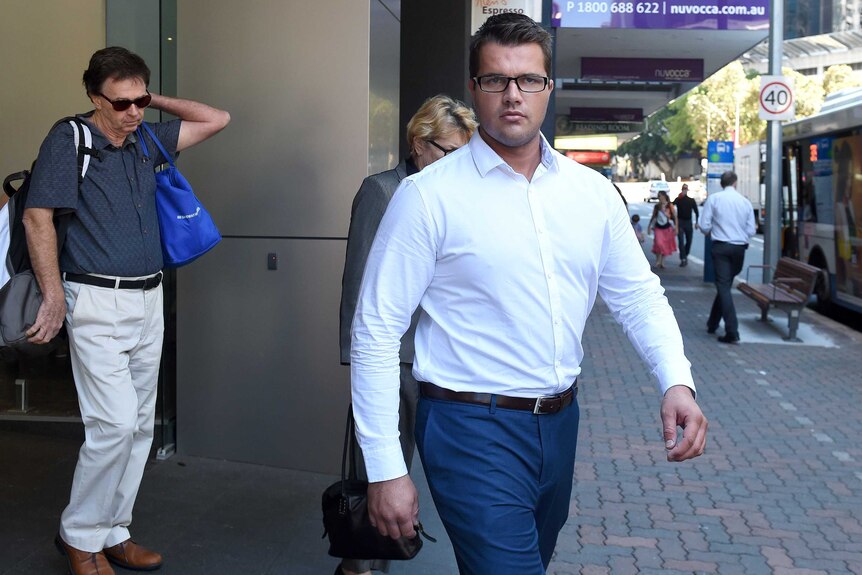 Gable Tostee walks with his parents to the Supreme Court in Brisbane