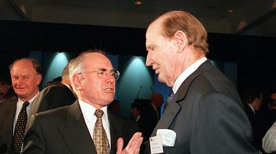 Kerry Packer chats with Prime Minister John Howard.