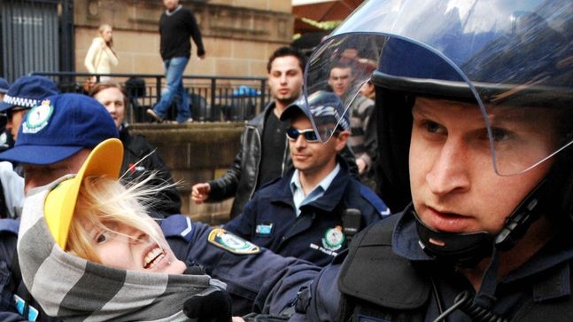 Arrests: Police grapple with a protester in Hyde Park