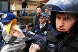 Police arrest a protester in Hyde Park following the Stop Bush rally in Sydney.