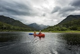 Two kayaks on the Clarence River after a rainstorm.