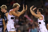 Solid start ... Stephen Milne celebrates a goal in St Kilda's win over Geelong.