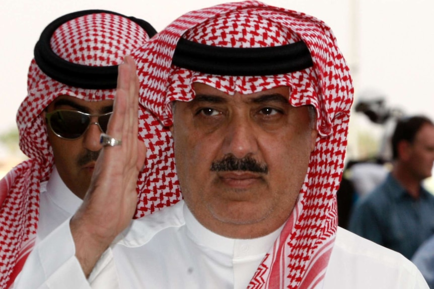 Prince Miteb bin Abdul Aziz salutes while leaving an equestrian club near Riyadh.