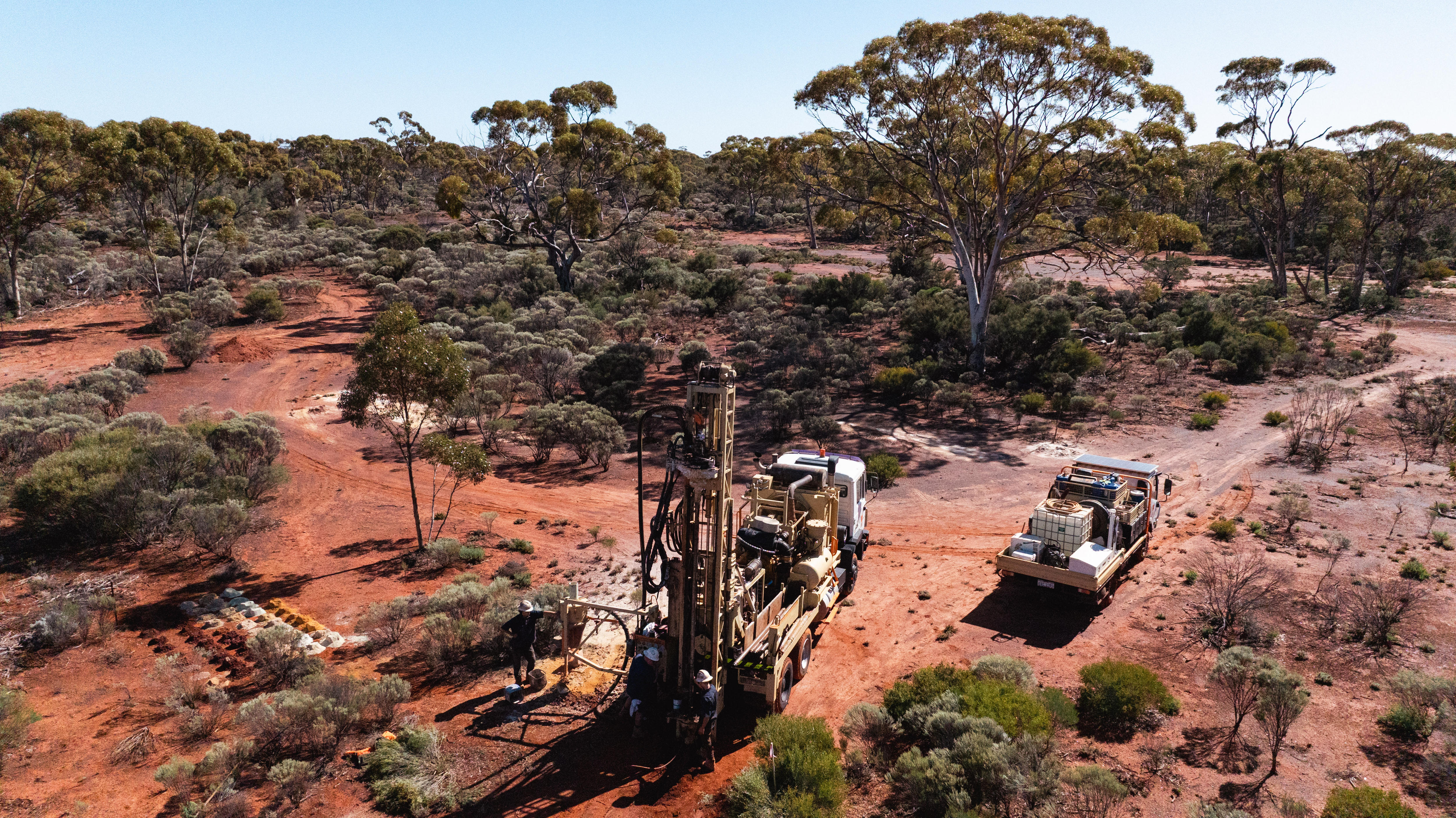 An aerial photograph of a drill rig operating in bushland.  