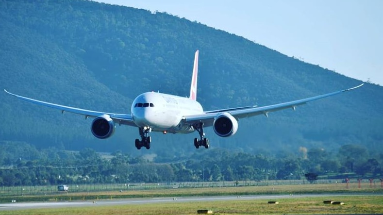 A specially chartered coronavirus flight en route from Delhi lands in Canberra before the travel ban.