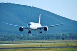 A Qantas plane touches down at Canberra airport