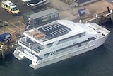 A party boat docked in a marina.