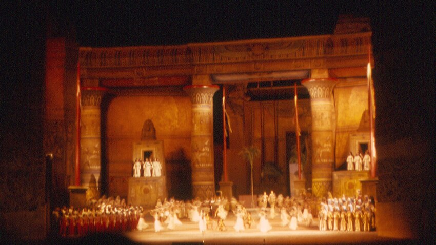 A photograph of a production of Verdi's Aida at night at the Baths of Caracalla in Rome. 