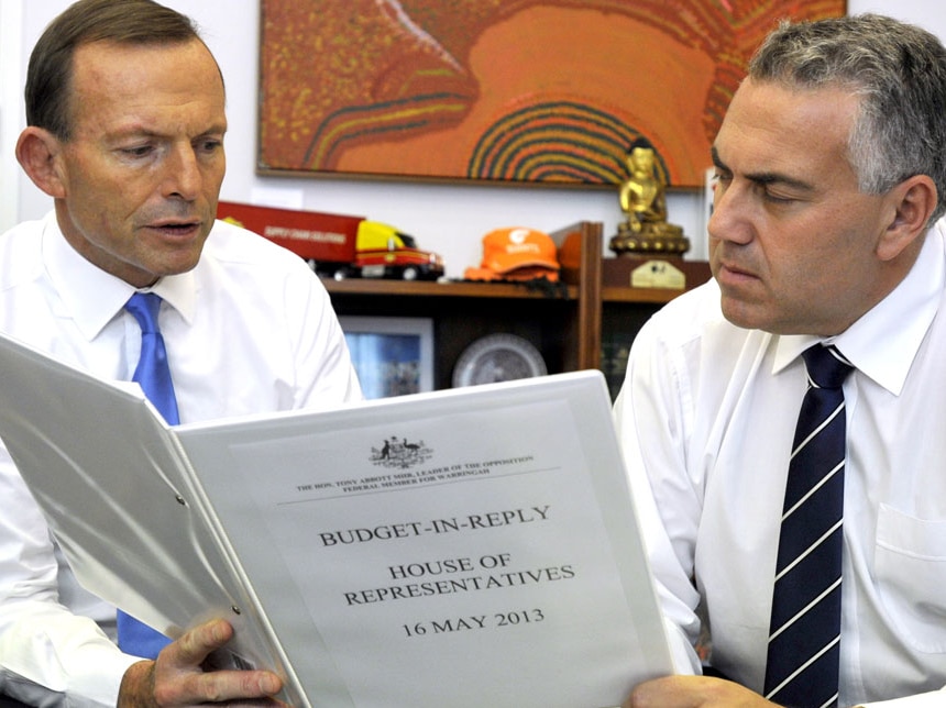 Tony Abbott and Joe Hockey discuss the Coalition's budget reply speech at Parliament House in Canberra. (AAP: Alan Porritt)