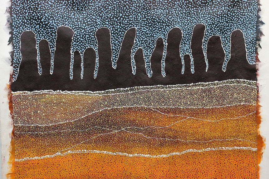 An aboriginal painting of a hill, with yellow in the foreground, brown peaks in the middle and a blue/black sky