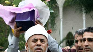 Supporters carried the sheikh on their shoulders from the mosque after his address.