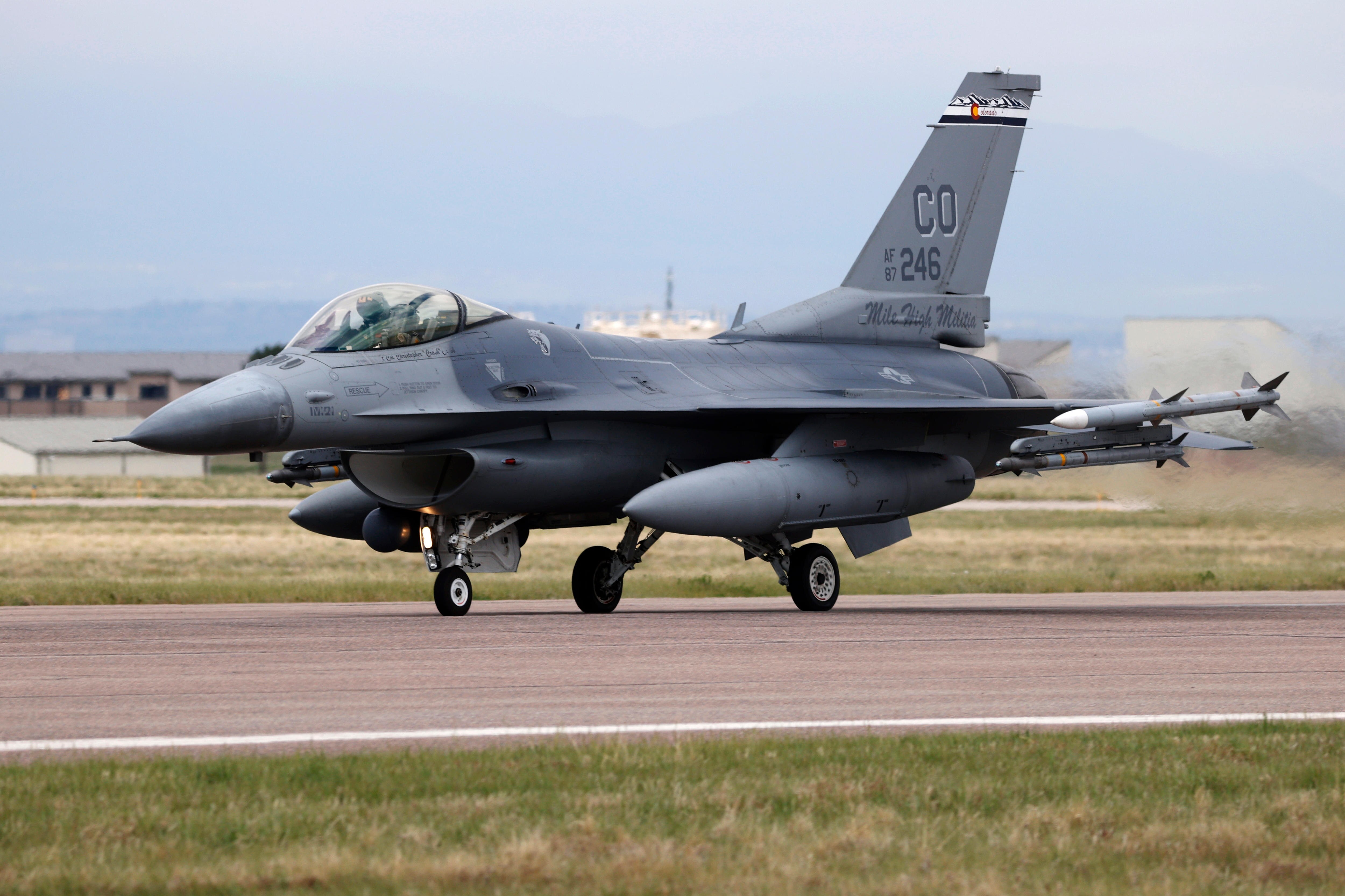 US F-16 fighter jet takes off from tarmac.