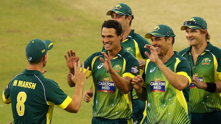 Nathan Coulter-Nile is congratulated after taking a wicket in the first ODI against South Africa