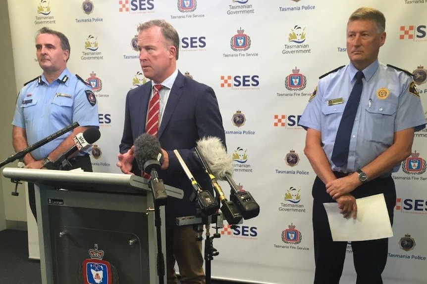 Will Hodgman with Tas Police Deputy Commissioner Insp Glenn Frame (L) and Jeremy Smith Deputy Chief Fire Officer (R)