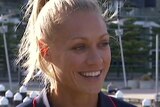 Erin Phillips laughs as she speaks to the media at a press conference by the Yarra River.