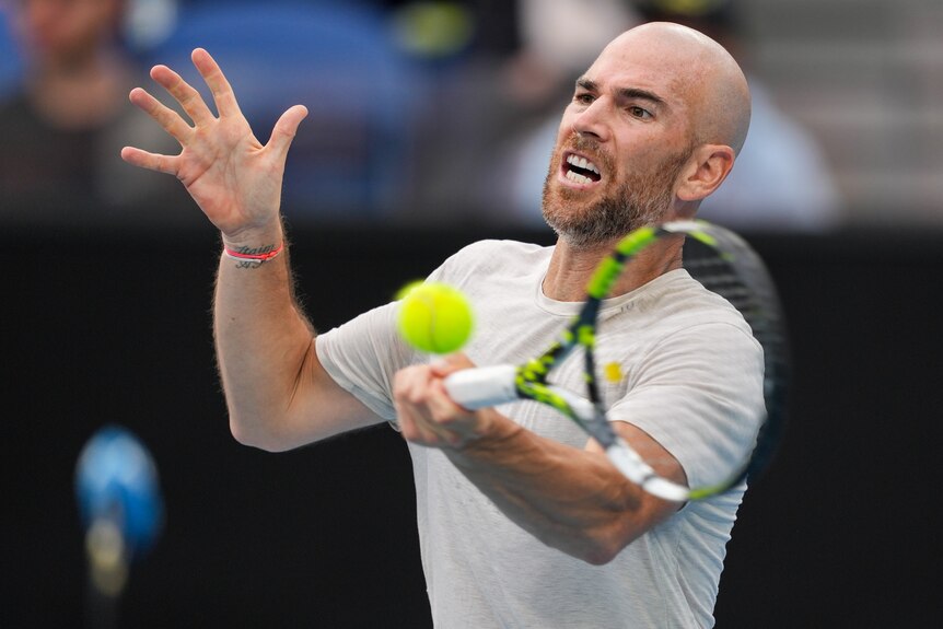 Adrian Mannarino plays a forehand at the 2024 Australian Open.