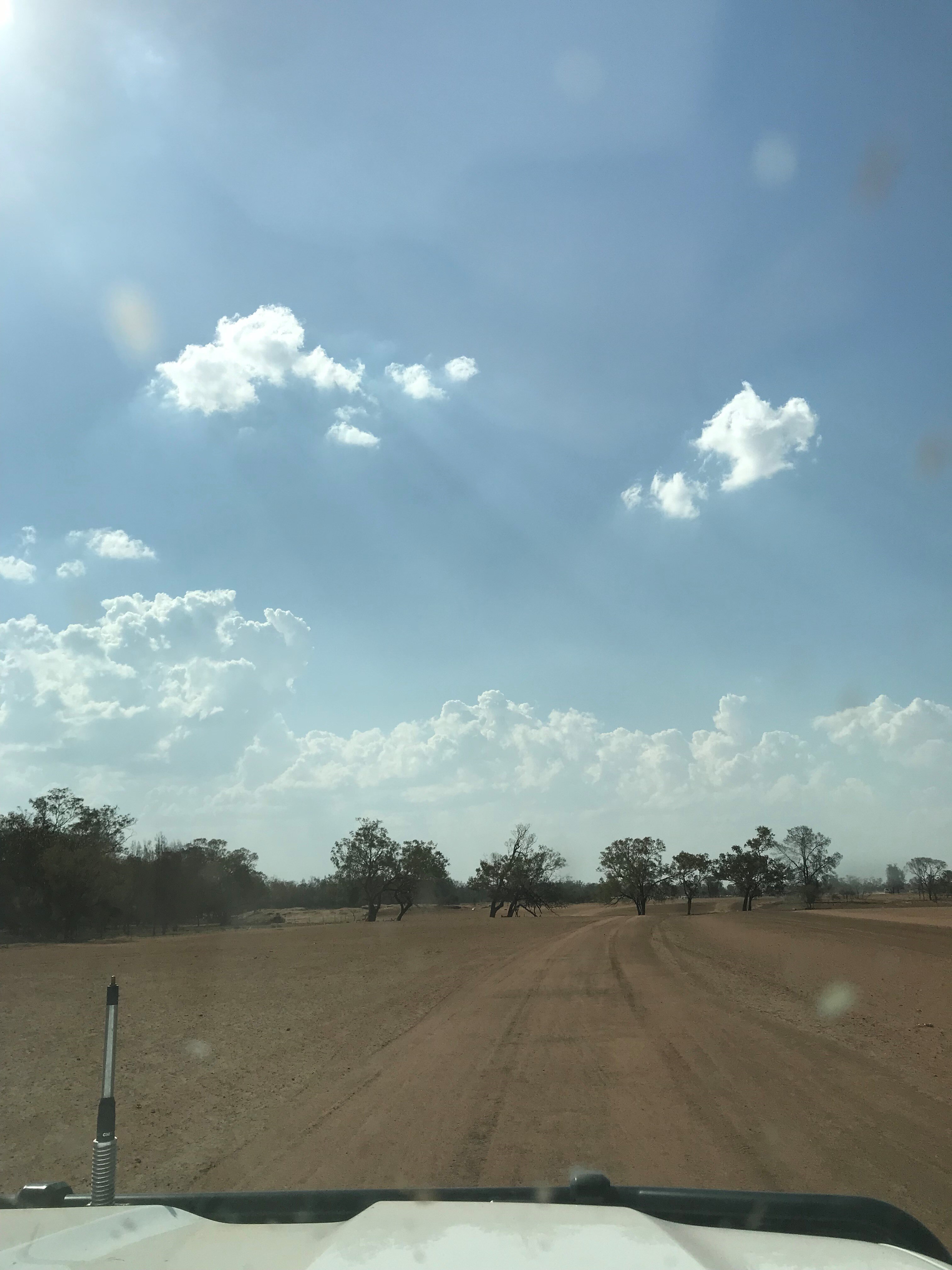 a car travelling on a dirt road