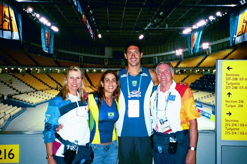 Laurie and Barbara Smith standing with two memebers fo the Brazillian Olympic team in 2004. 