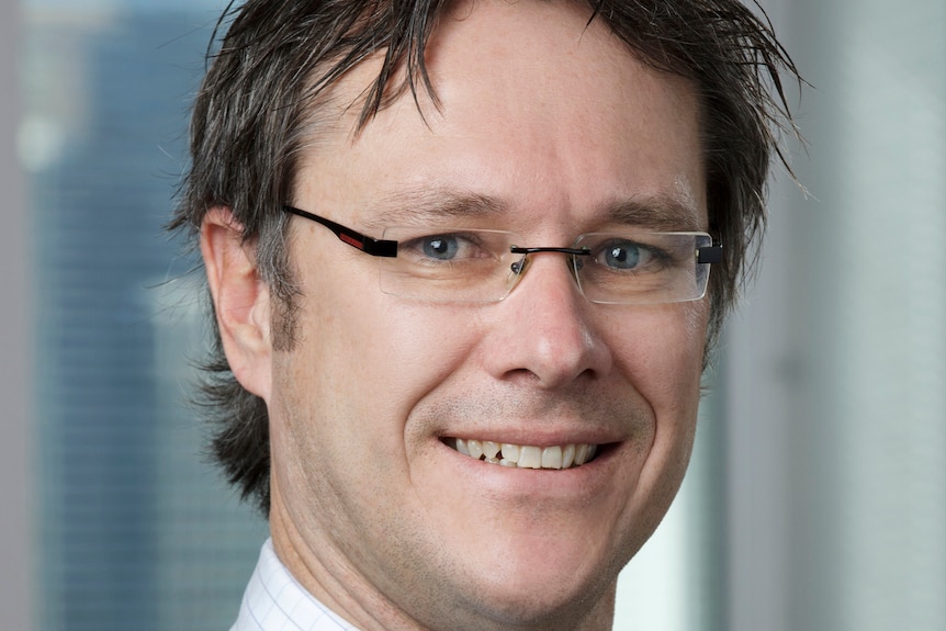 Headshot of RBA deputy governor Guy Debelle