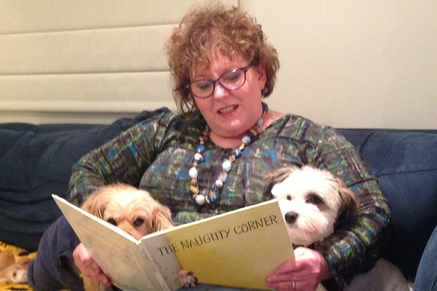 Vanessa Little reads to her dogs