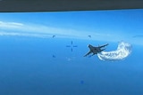 A fighter jet heading towards the camera.