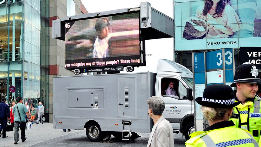 A van displaying images of people wanted in connection with the riots is pictured in Birmingham city centre on August 12, 2011.
