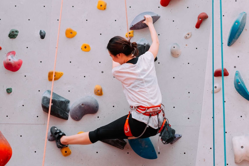 Woman rock climbing