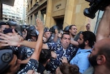 Lebanese activists clash with riot police outside the environment ministry in downtown Beirut