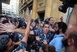 Lebanese activists clash with riot police outside the environment ministry in downtown Beirut