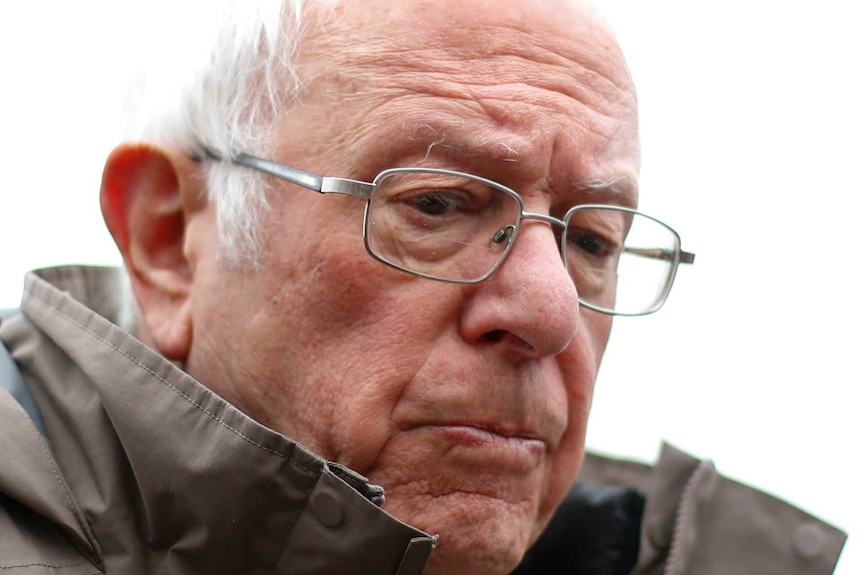 Democratic presidential candidate Sen. Bernie Sanders looks down