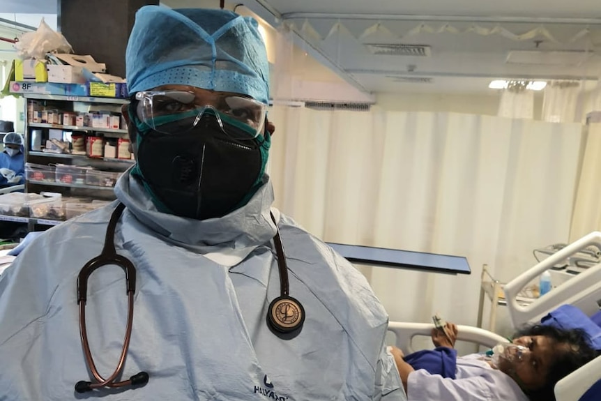 Dr Deepak Kumar in hospital scrubs in India