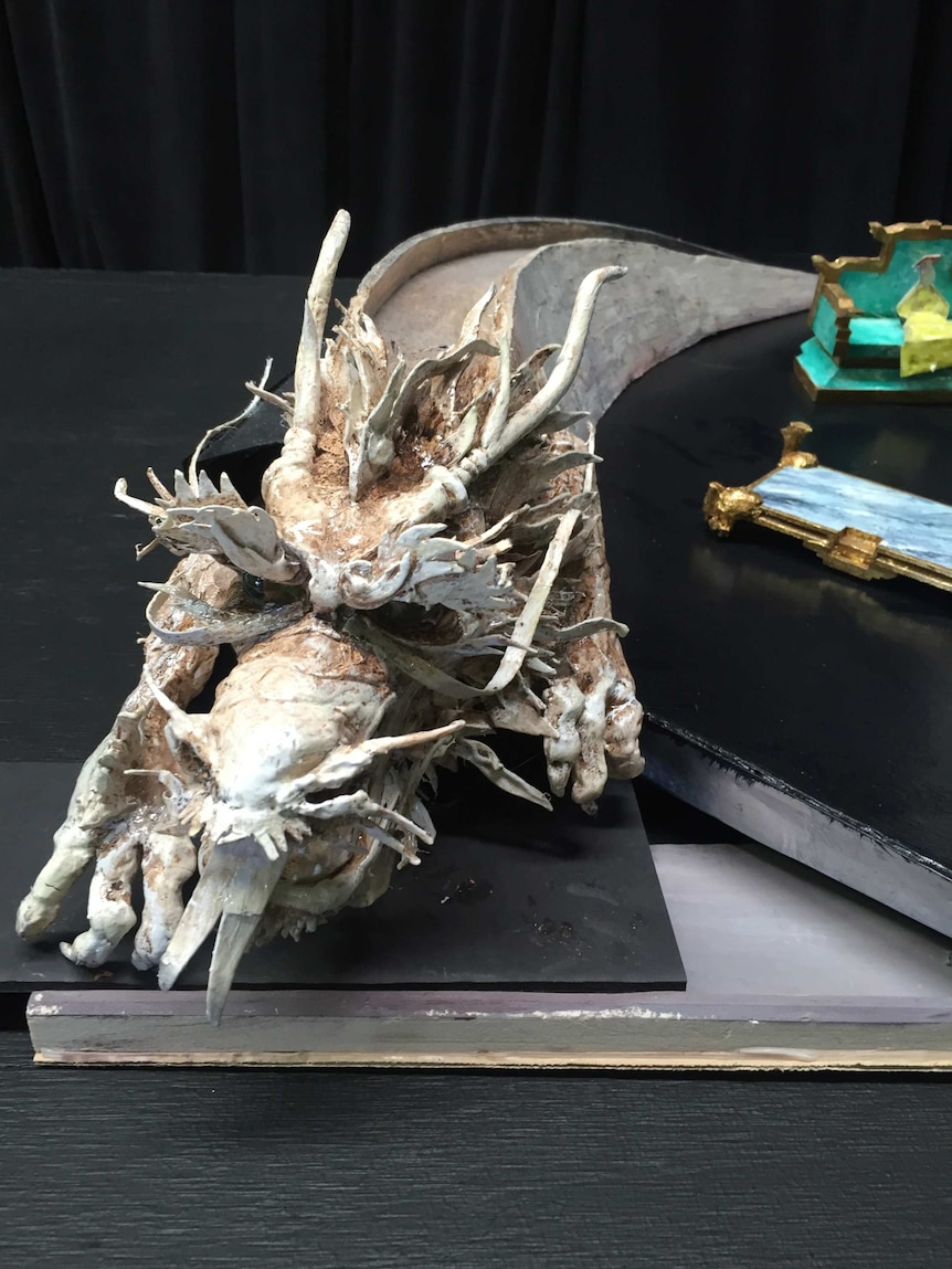 A base model of a Chinese dragon sculpture.