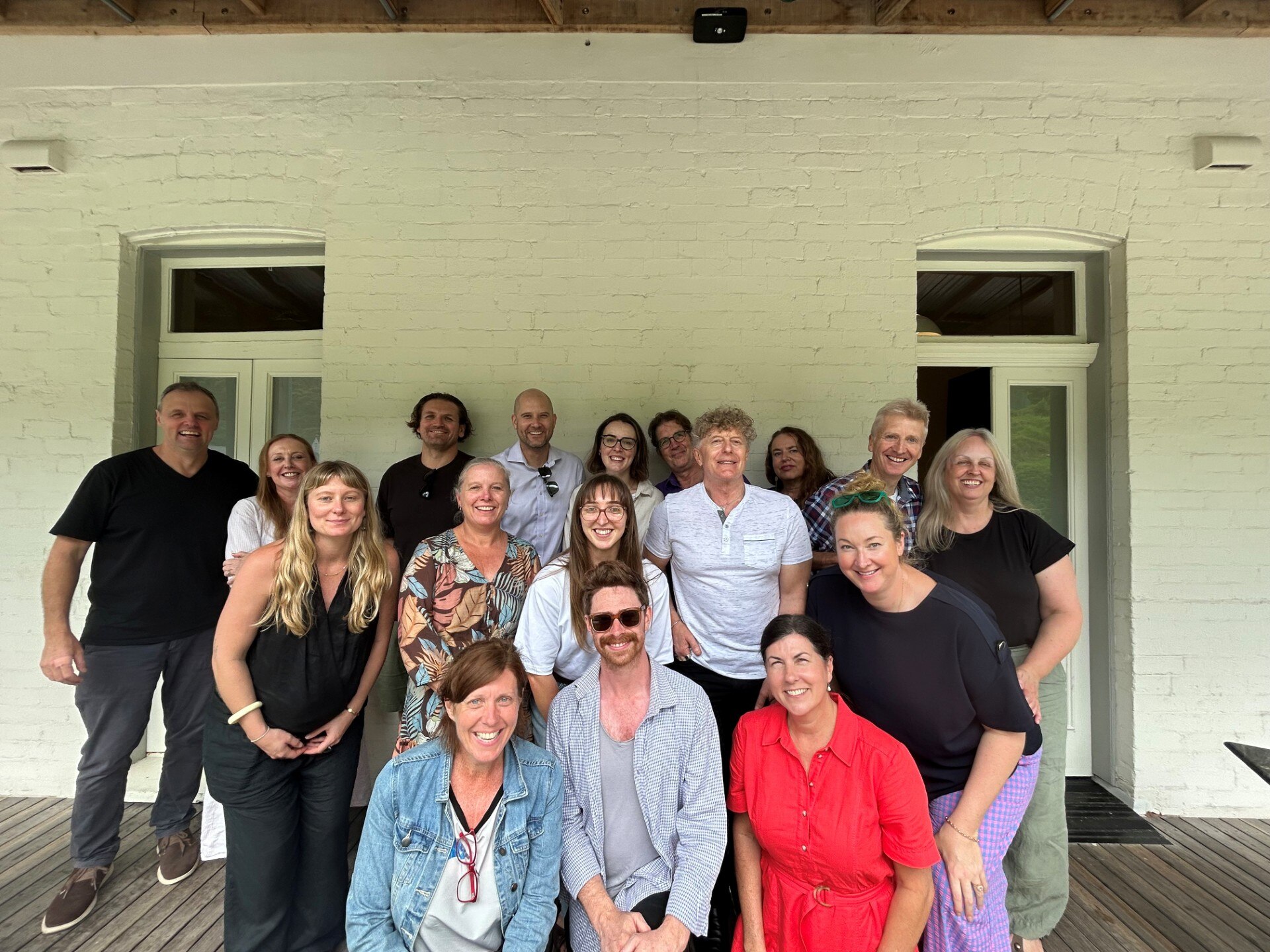 A group of people in front of a building.