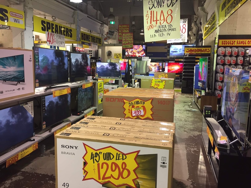 TVs on the shop floor at a JB Hi Fi store