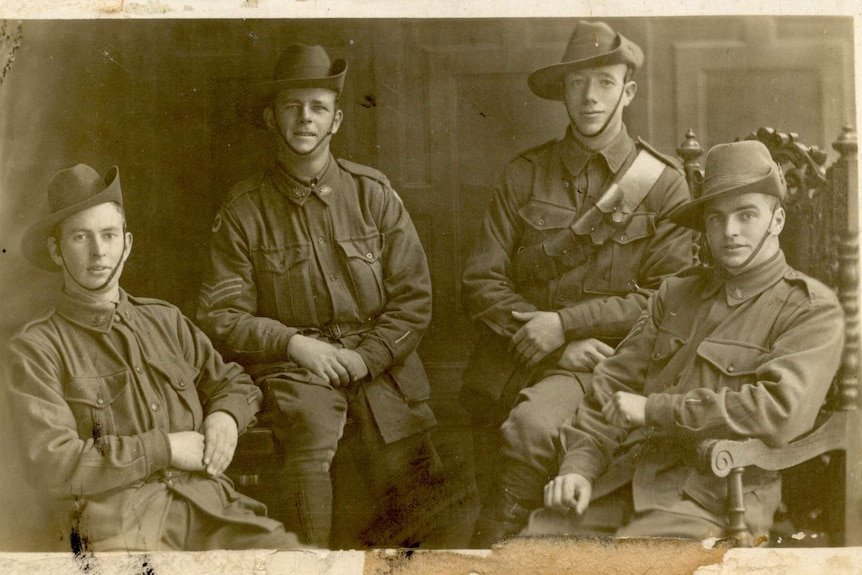 Sepia photo of four young soldiers during WWI
