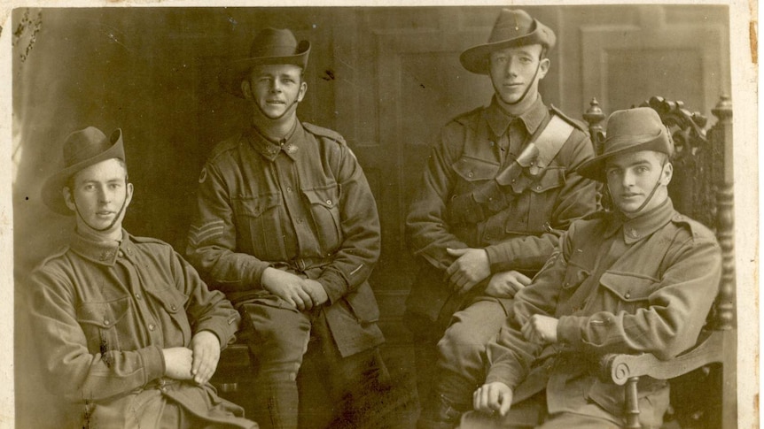 Sepia photo of four young soldiers during WWI