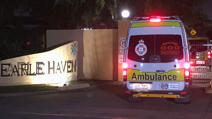 An ambulance outside an aged care home after dark