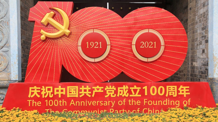 Large red sign indicating 100 and the Communist Party symbol commemorates its 100th anniversary