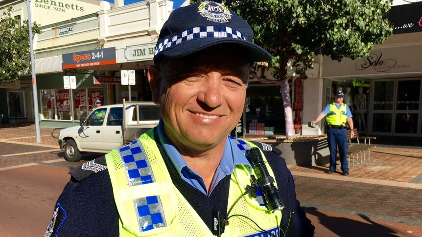 A photo of Senior Constable Keith Burrows smiling for the camera in downtown Geraldton where he is conducting a RBT stop.