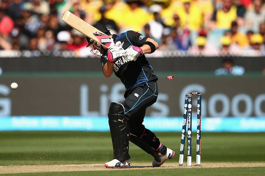 Brendon McCullum is bowled by Mitchell Starc in the Cricket World Cup final