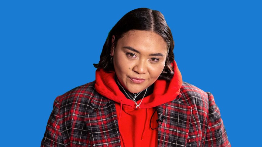 Kira Puru on triple j's Inspired video series, in front of a blue background