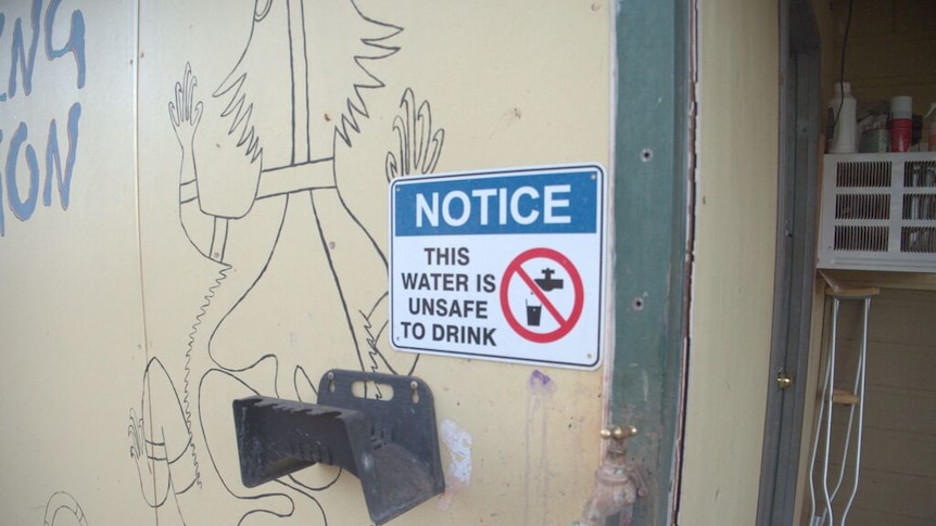 signage installed by the Department of Communities warning about unsafe drinking water