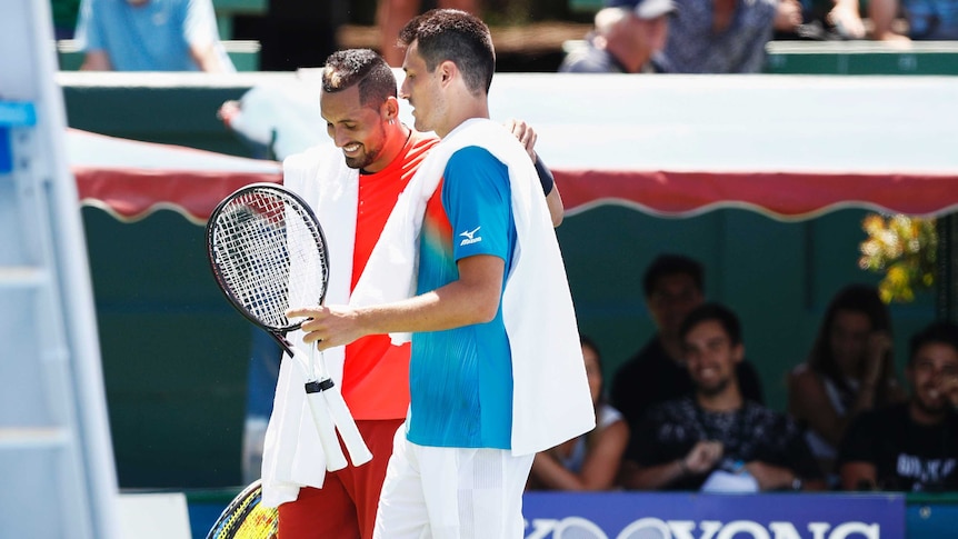 Nick Kyrgios smiles as he chats to Bernard Tomic after their match at the Kooyong Classic on January 9, 2019.