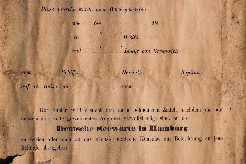 An image of the world's oldest message in a bottle. The note is a form used as part of an experiment to understand ocean current